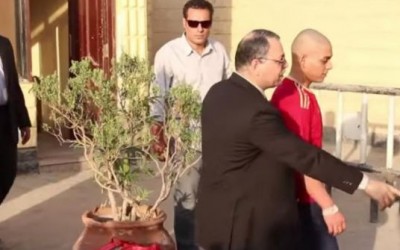Interior Ministry officer orders released detainee to bow down for cameras
